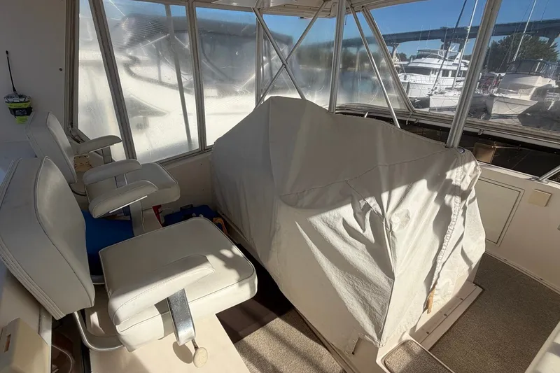 Slide: The Image of Interior of 1990 Viking 44 Motor Yacht with covered equipment and seating. - 20