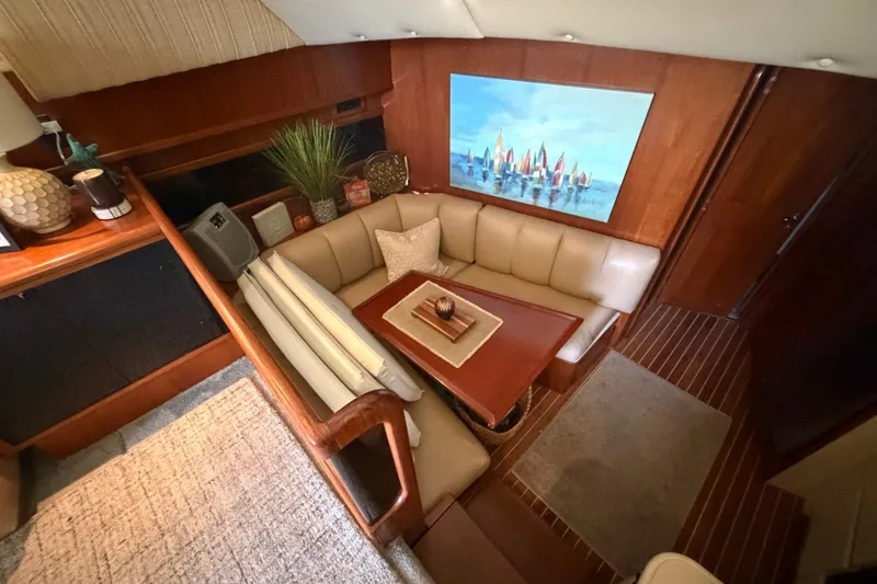 Slide: The Image of Interior of 1990 Viking 44 Motor Yacht with cozy seating and nautical decor. - 32