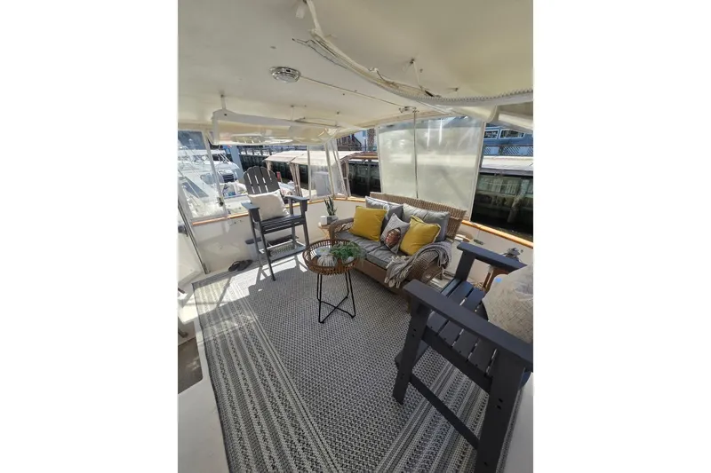 Slide: The Image of Cozy interior of 1990 Viking 44 Motor Yacht with seating and decor. - 17