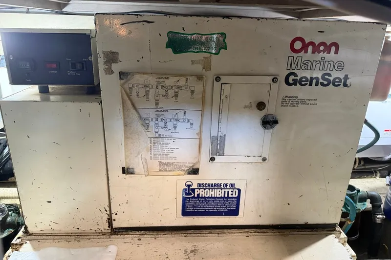 Slide: The Image of Onan Marine GenSet in a 1990 Viking 44 Motor Yacht engine room. - 47