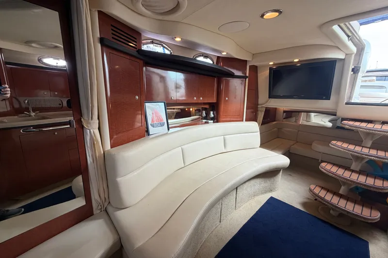 Slide: The Image of Luxurious interior of a 2005 Sea Ray 340 Sundancer yacht with elegant seating and modern amenities. - 20