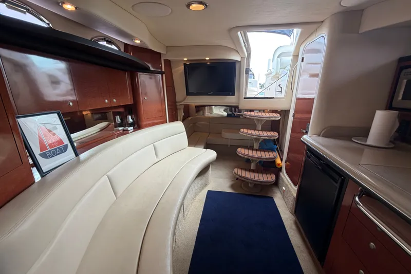 Slide: The Image of Luxurious interior of a 2005 Sea Ray 340 Sundancer yacht with elegant seating and modern amenities. - 19