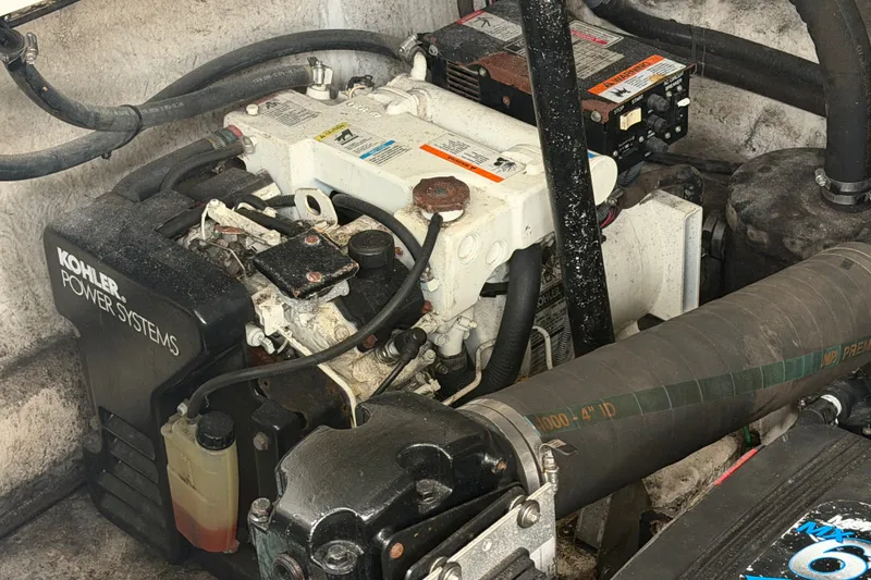 Slide: The Image of Engine compartment of a 2005 Sea Ray 340 Sundancer with Kohler power system. - 24