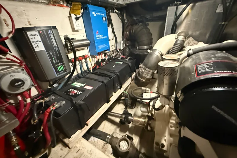 Slide: The Image of Engine room of a 2001 Carver 506 Motor Yacht with batteries and electrical components. - 46
