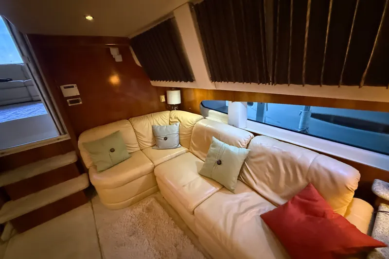 Slide: The Image of Luxurious interior of 2001 Carver 506 Motor Yacht with plush seating and elegant decor. - 23