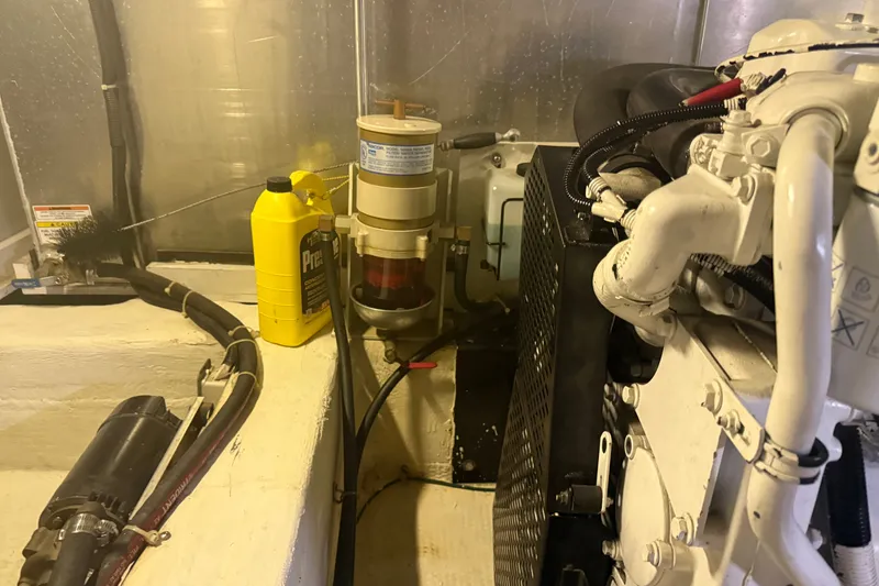 Slide: The Image of Engine room of a 2001 Carver 506 Motor Yacht with maintenance supplies. - 53