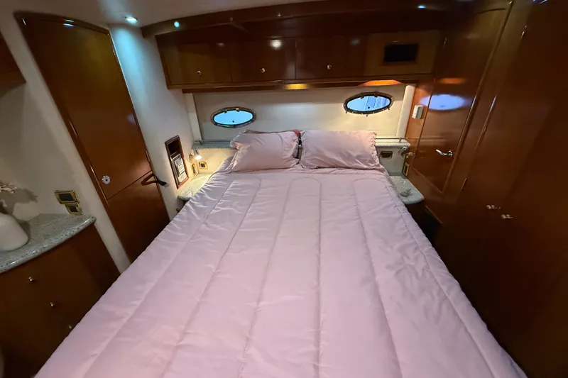 Slide: The Image of Luxurious bedroom interior of 2001 Carver 506 Motor Yacht with pink bedding. - 29