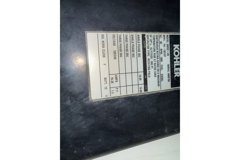 Slide: The Image of Label on Kohler generator in 2001 Carver 506 Motor Yacht, showing specifications and voltage details. - 49