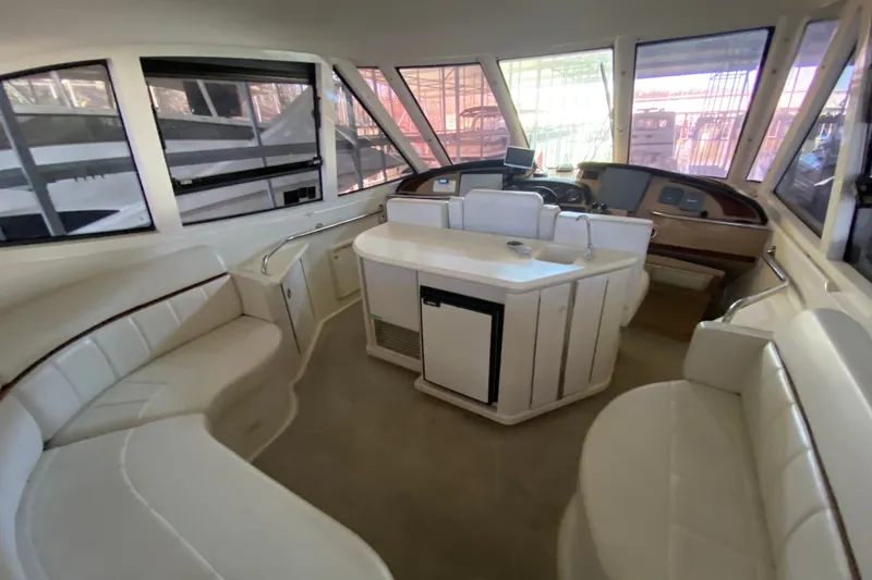 Slide: The Image of Interior of 2001 Carver 506 Motor Yacht with spacious seating and helm station. - 16