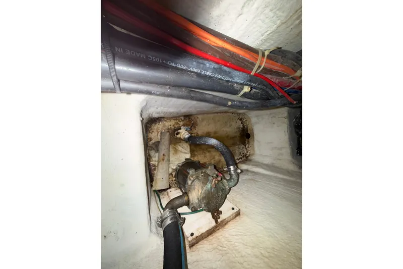 Slide: The Image of Bilge area of 2001 Carver 506 Motor Yacht showing cables and pump system. - 50