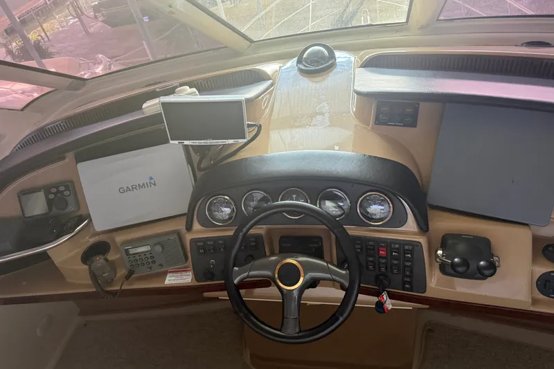 Slide: The Image of Helm of 2001 Carver 506 Motor Yacht with Garmin navigation system and control panel. - 26