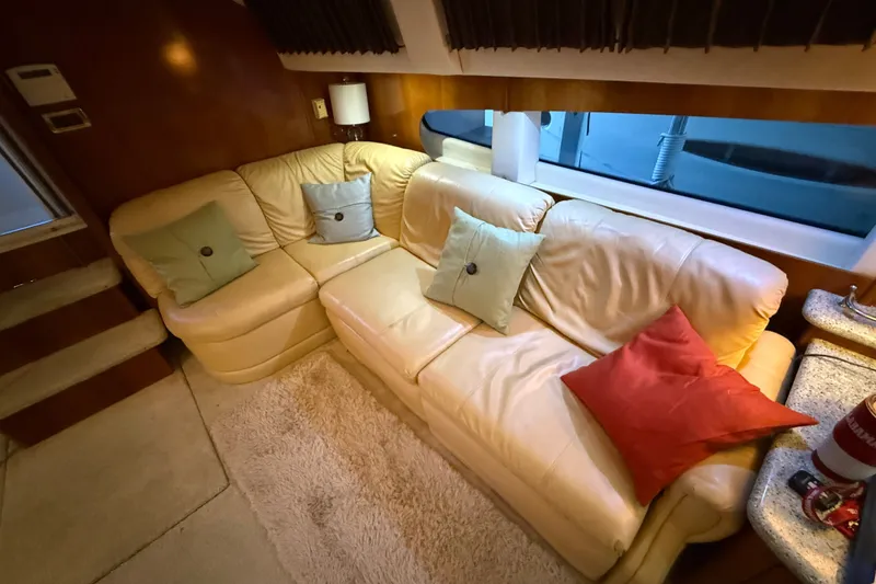 Slide: The Image of Luxurious interior of 2001 Carver 506 Motor Yacht with plush leather seating and colorful cushions. - 19