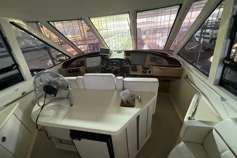 Slide: The Image of Interior helm of 2001 Carver 506 Motor Yacht with steering wheel and navigation equipment. - 18