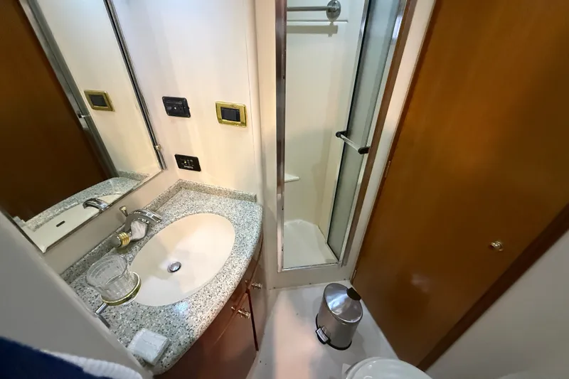 Slide: The Image of Bathroom interior of 2001 Carver 506 Motor Yacht with granite countertop and shower. - 33