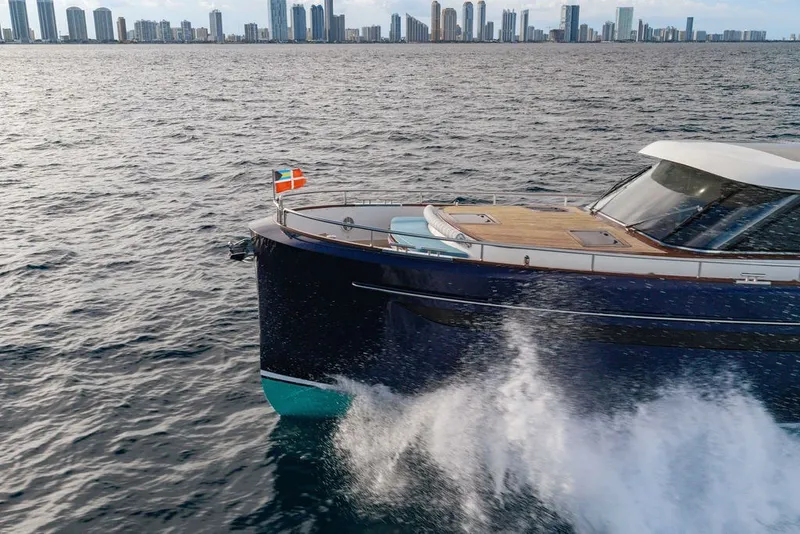 Slide: The Image of Steeler 60S yacht cruising near city skyline, 2021 model. - 24