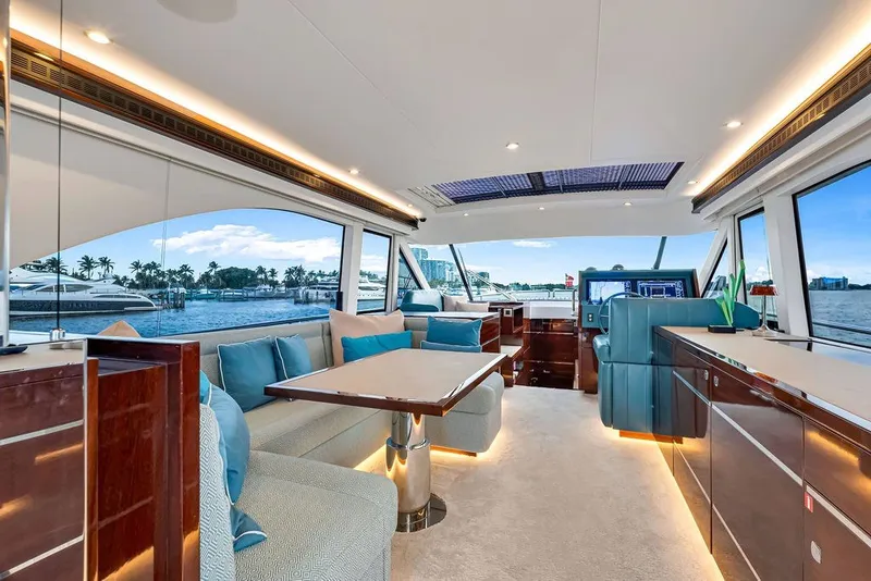 Slide: The Image of Luxurious interior of 2021 Steeler 60S yacht with elegant seating and panoramic windows. - 67