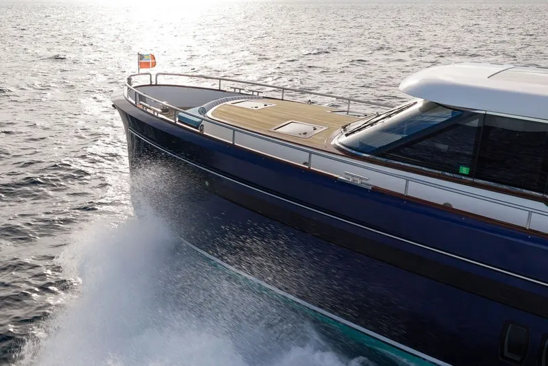 Slide: The Image of Steeler 60S 2021 yacht cruising on open water, showcasing sleek design and luxury. - 23
