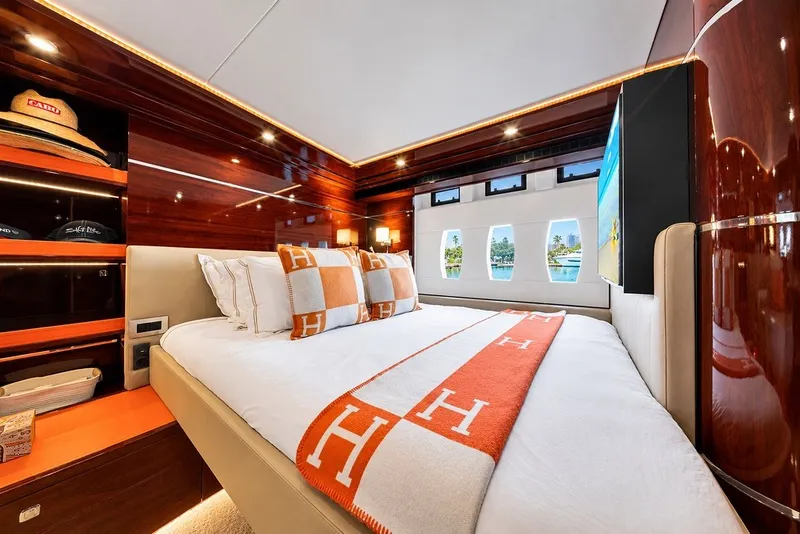 Slide: The Image of Luxurious cabin interior of 2021 Steeler 60S yacht with elegant bedding and wood finishes. - 105