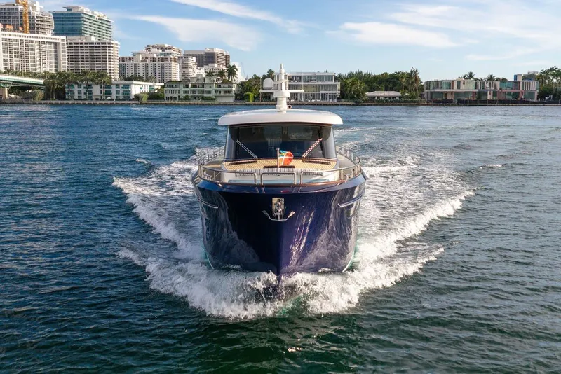 Slide: The Image of 2021 Steeler 60S yacht cruising in a scenic urban waterfront setting. - 35