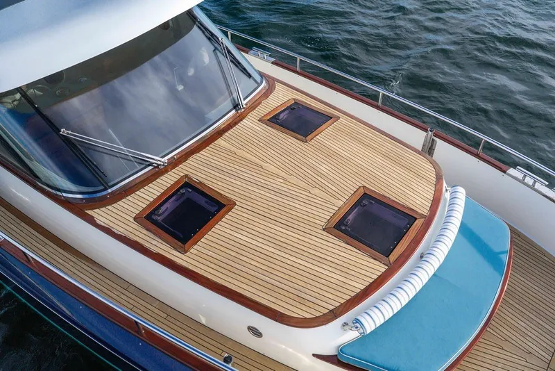 Slide: The Image of 2021 Steeler 60S yacht deck with teak finish and ocean view. - 44