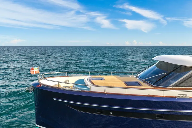 Slide: The Image of Luxurious 2021 Steeler 60S yacht cruising on open sea under clear blue sky. - 10