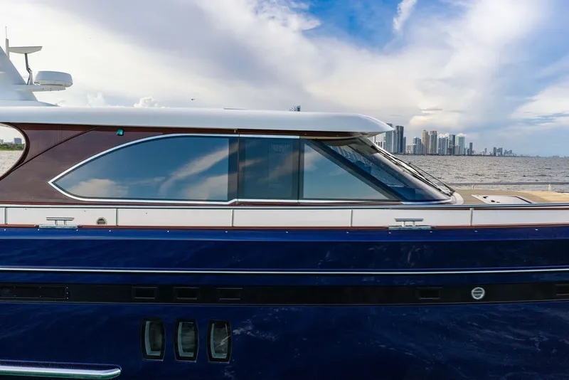 Slide: The Image of 2021 Steeler 60S yacht with sleek design, city skyline in background. - 11