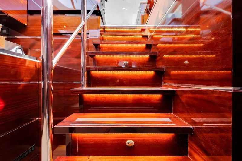 Slide: The Image of Luxurious wooden staircase with LED lighting on a 2021 Steeler 60S yacht. - 84