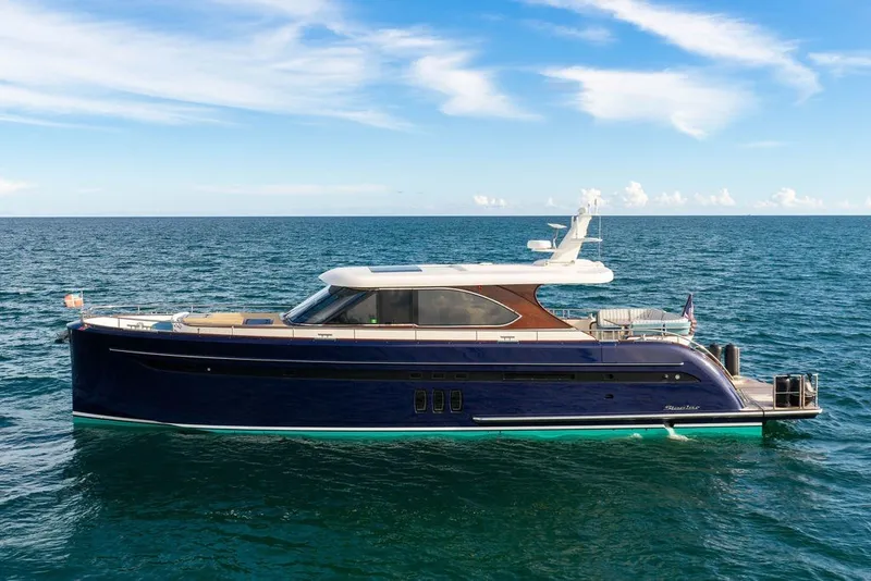 Slide: The Image of Luxury 2021 Steeler 60S yacht cruising on open sea under clear blue sky. - 9