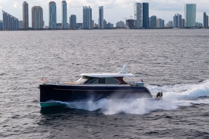 Slide: The Image of Steeler 60S yacht cruising near city skyline, 2021 model. - 18