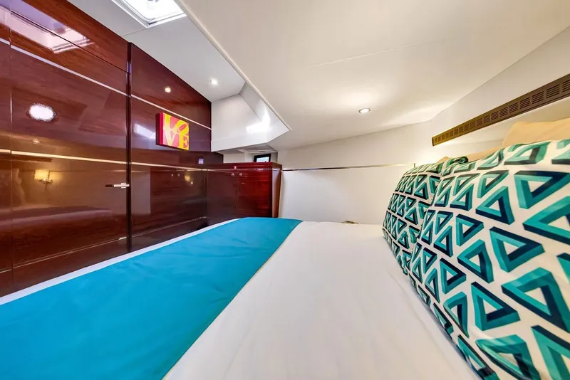 Slide: The Image of Luxurious interior cabin of 2021 Steeler 60S yacht with modern decor and geometric pillows. - 99