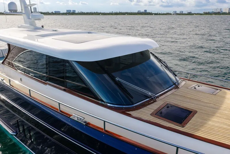 Slide: The Image of Luxury 2021 Steeler 60S yacht with sleek design on open water. - 2