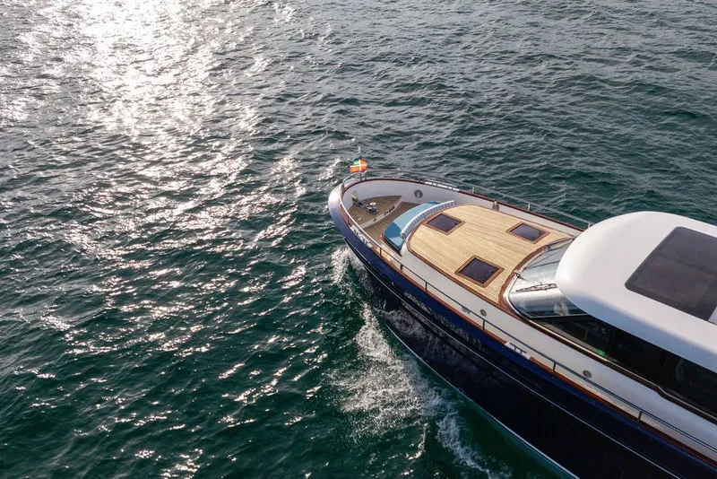 Slide: The Image of Steeler 60S 2021 yacht cruising on shimmering ocean waters. - 34