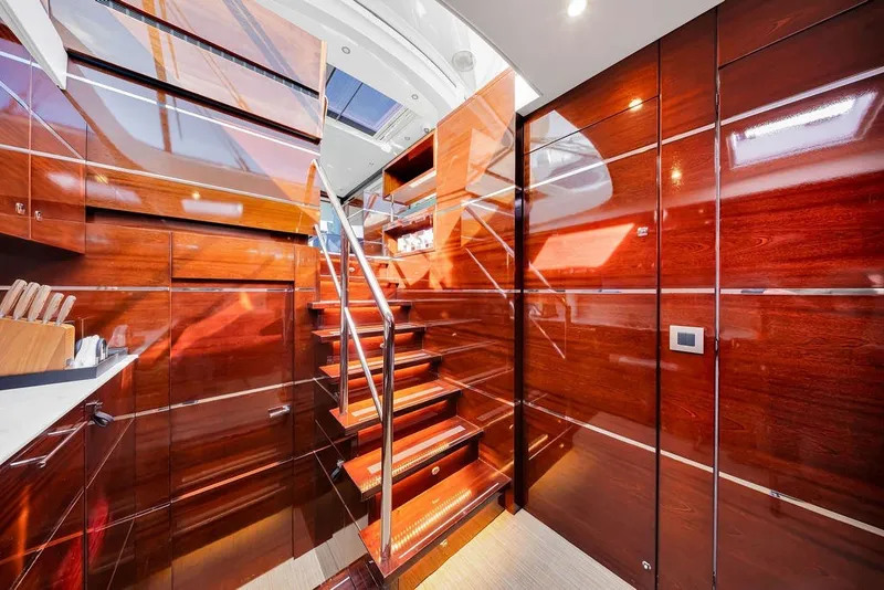 Slide: The Image of Luxurious interior of 2021 Steeler 60S yacht with polished wood and modern staircase. - 86