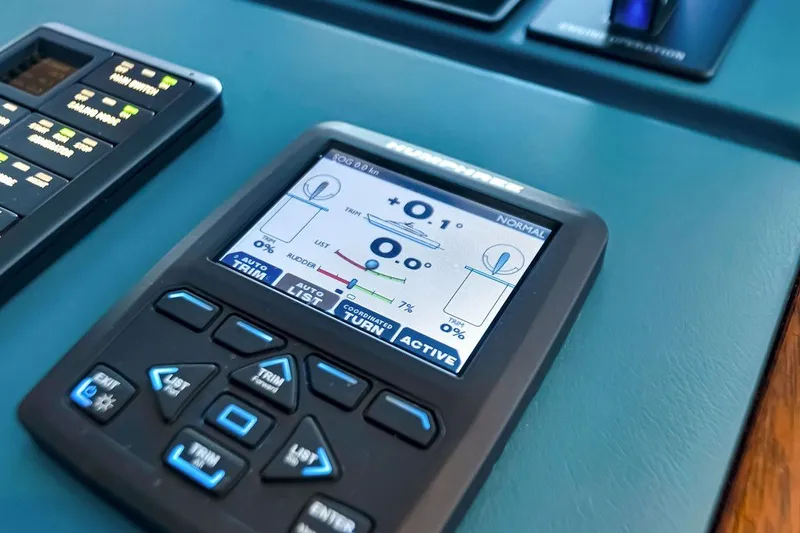 Slide: The Image of Control panel of a 2021 Steeler 60S yacht, featuring navigation and trim settings. - 81