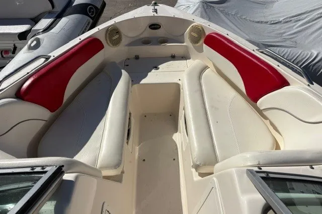 Slide: The Image of 2002 Rinker 212 Captiva Bowrider interior with red and white seating. - 10