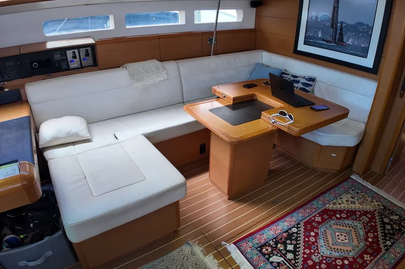 Slide: The Image of Interior of 2012 Jeanneau Sun Odyssey 509 yacht with cozy seating and wooden table. - 10