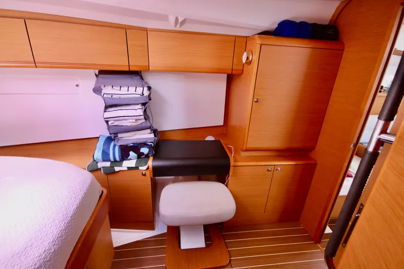 Slide: The Image of Interior of 2012 Jeanneau Sun Odyssey 509 yacht with wooden cabinetry and seating. - 5