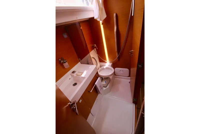 Slide: The Image of Bathroom interior of 2012 Jeanneau Sun Odyssey 509 yacht, featuring sink and toilet. - 3