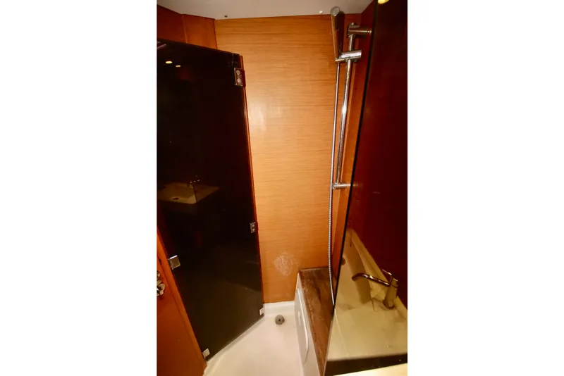 Slide: The Image of Bathroom interior of 2012 Jeanneau Sun Odyssey 509 yacht, featuring modern shower and sink. - 6