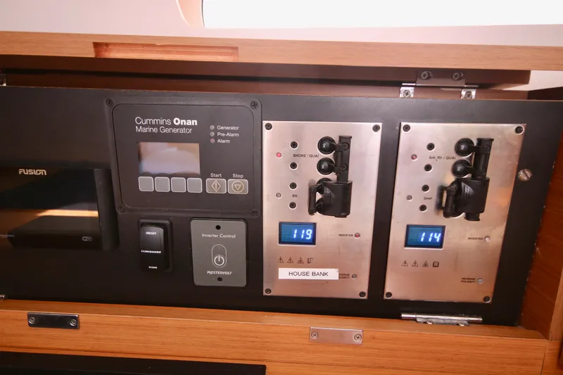 Slide: The Image of Panel at nav station. Breakers, generator panel, and controls for miscellaneous items. Fusion Stereo. - 12