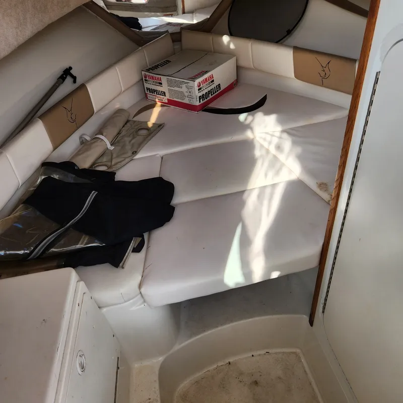 Slide: The Image of Interior of the 2003 Seaswirl Striper 2601 Walkaround O/B with seating and storage. - 10