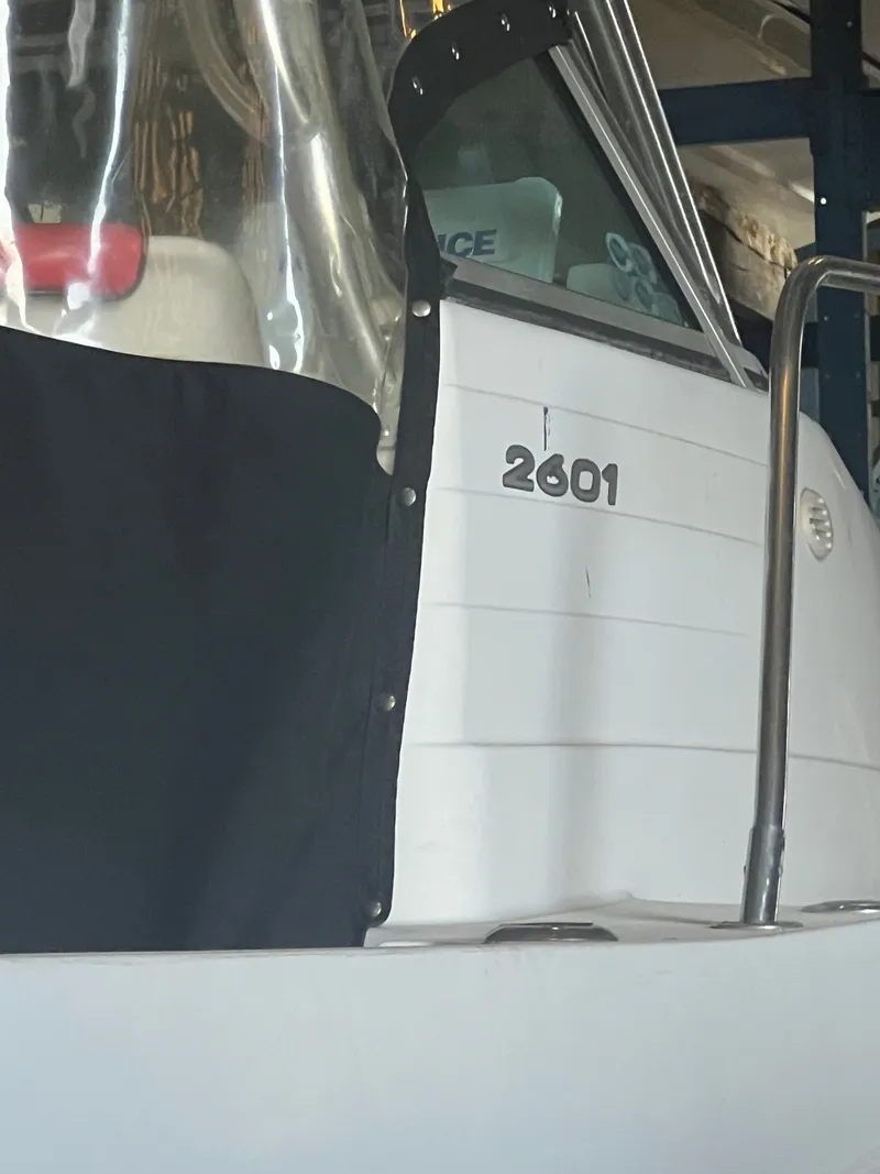 Slide: The Image of Close-up of a white boat with "2601" marked on the side. - 8