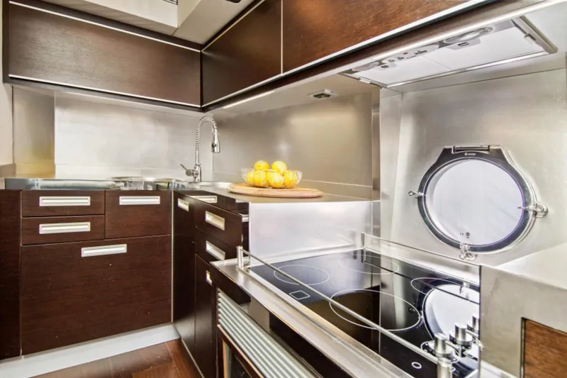 Slide: The Image of Luxurious kitchen interior of 2009 Azimut 68S yacht with modern appliances and sleek design. - 9