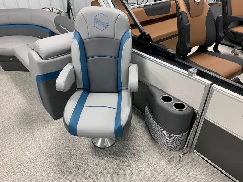 Slide: The Image of 2023 South Bay S224 RS boat interior with gray and blue captain's chair. - 11