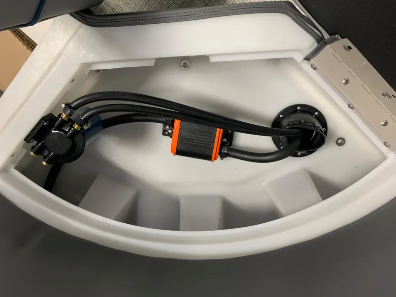 Slide: The Image of 2023 South Bay S224 RS boat interior compartment with wiring and components. - 27