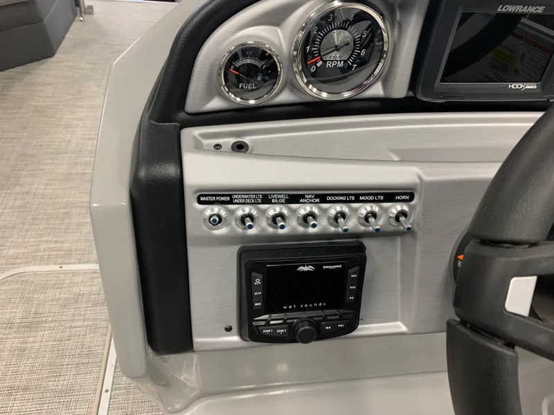 Slide: The Image of 2023 South Bay S224 RS boat dashboard with gauges and control panel. - 8