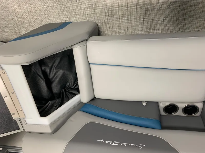 Slide: The Image of 2023 South Bay S224 RS boat interior with storage compartment and cup holders. - 29