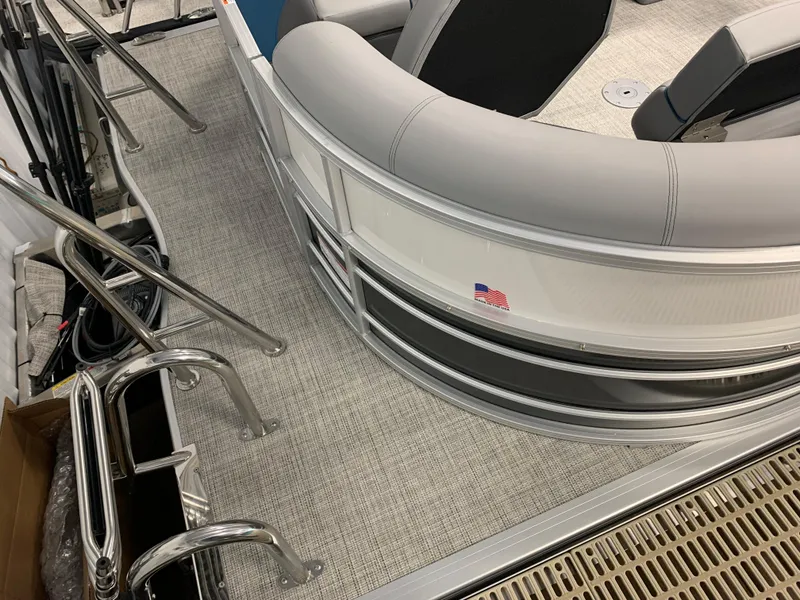 Slide: The Image of 2023 South Bay S224 RS pontoon boat interior with seating and stainless steel railings. - 24