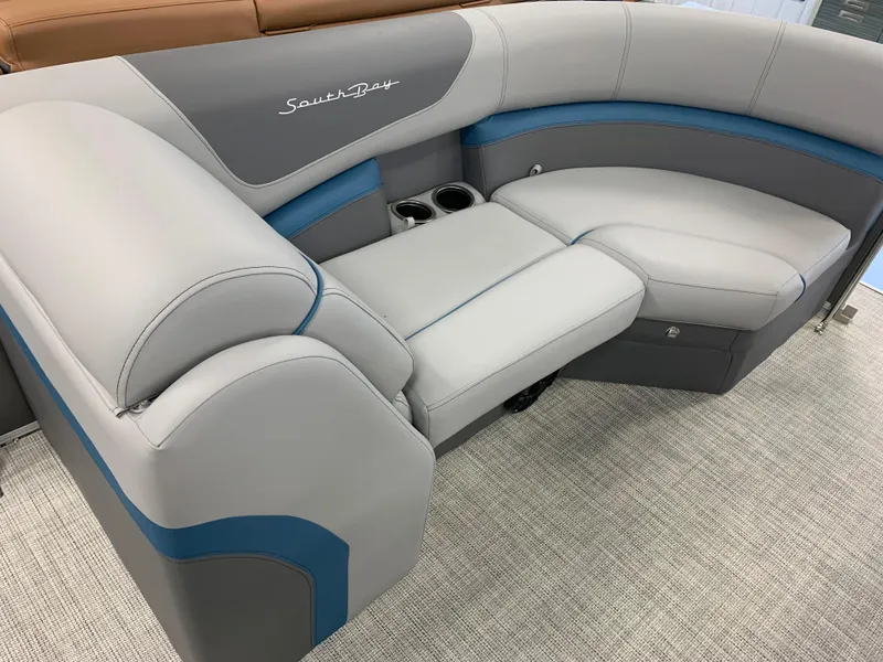 Slide: The Image of 2023 South Bay S224 RS boat interior seating with cup holders. - 14