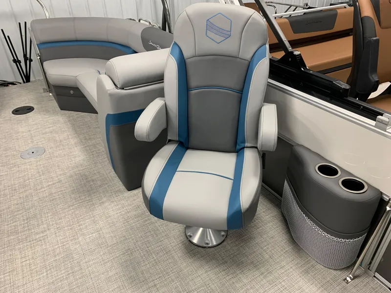 Slide: The Image of 2023 South Bay S224 RS boat interior with grey and blue seating. - 12